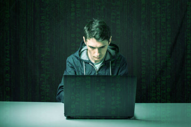 istock hacker in the dark breaks the access to steal information 664874620