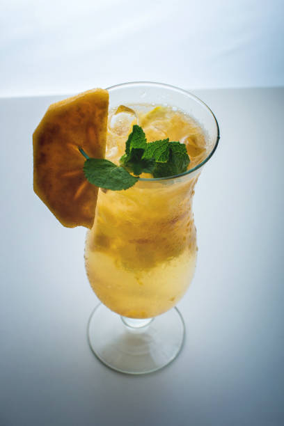 istock Fruit lemonade in a glass hurricane with persimmon and mint 664875050