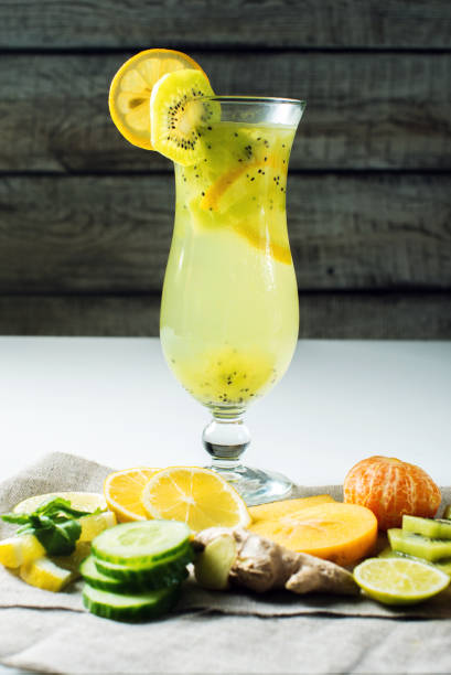 istock Fruit lemonade in hurricane glass with kiwi and lemon 664875072