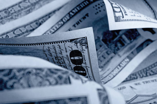 istock Cash US dollars in black and white. 664877840