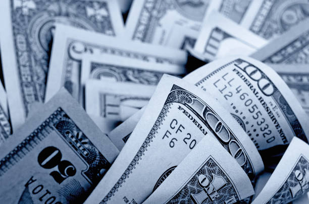 istock Cash US dollars in black and white. 664877876