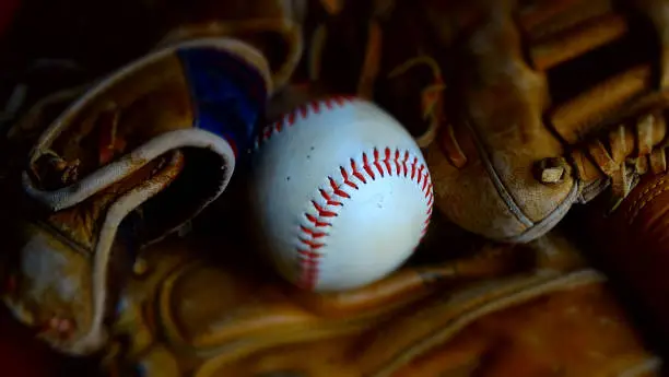 Photo of Baseball and baseball gloves.