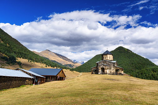 Old church of Holy Trinity in Shenako village on southern slope of the Greater Caucasus In autumn. Tusheti region. Georgia