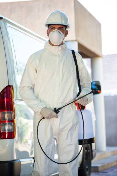 istock Portrait of pest control man standing next to a van 664890222