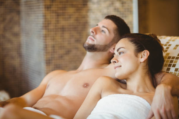 istock Happy couple lying down together 664892620