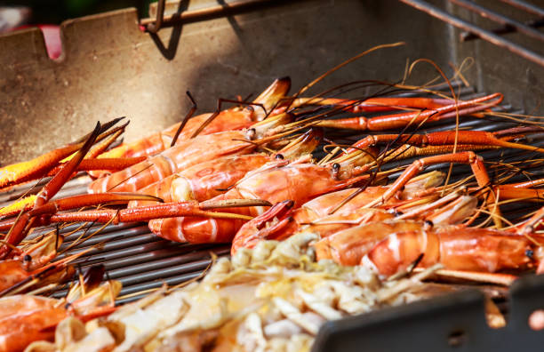 istock Hot BBQ Grilled river prawns on the picnic stove 664899646
