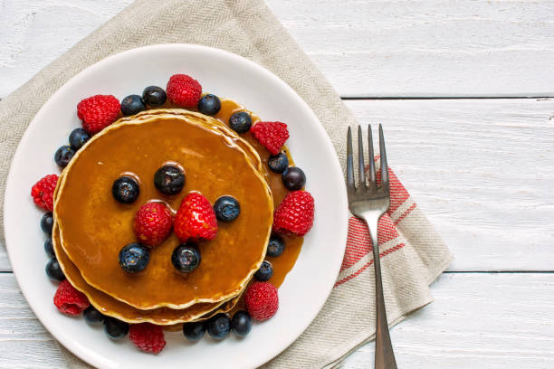 istock pancakes with berries and caramel sauce 664900400