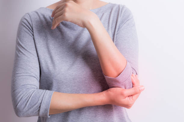 istock Asian woman with elbow pain. 664911496
