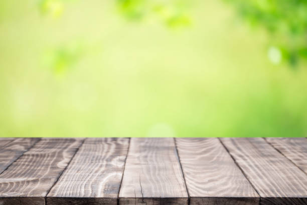 istock Old wood coordination table top on nature background 664911658
