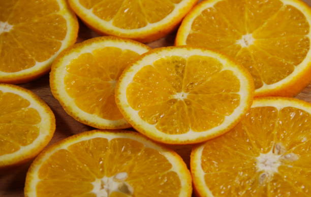 istock Background of sliced  juicy oranges fruit 664915558