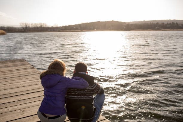 istock couple enjoying on lake pier 664916236