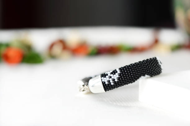 istock Beaded bracelet with a skull image close up 664917174