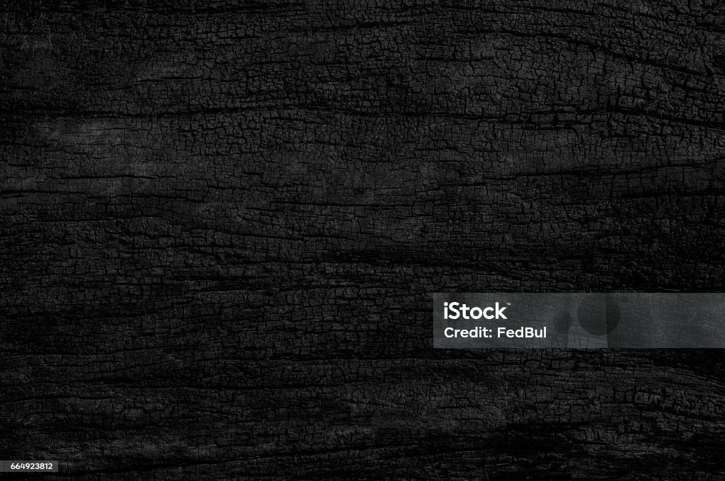 Black grunge background. Burned wood texture. Wood - Material Stock Photo