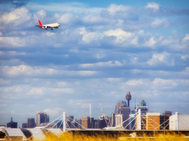 istock Airplane Midair Over CBD 664924396