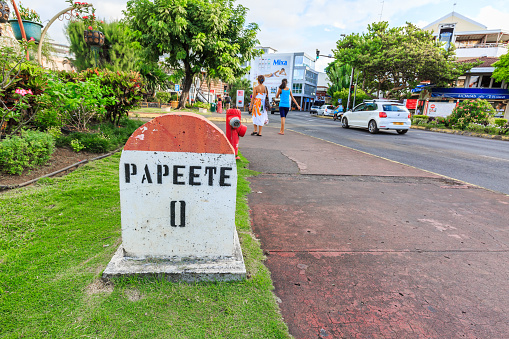 Papeete, French Polynesia – MAY 20, 2017 :  A  Zero Kilometer stone on the road in the town of Papeete early in the morning in Tahiti  Papeete, French Polynesia.