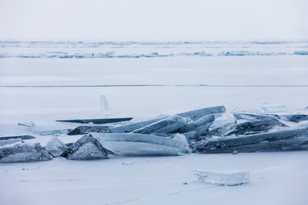 istock Turquoise ice floe. Winter landscape. Baikal lake 664927608