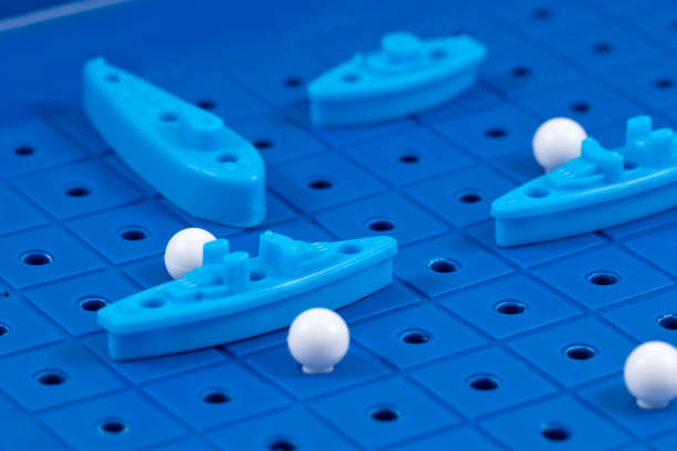 istock Toy war ships and submarine lined up to play 664931108
