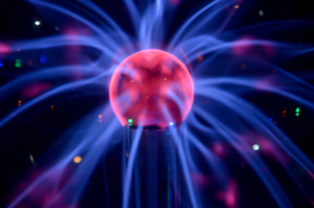 istock Plasma Tesla reactor orb in a dark creating beautiful blue line pattern 664931150
