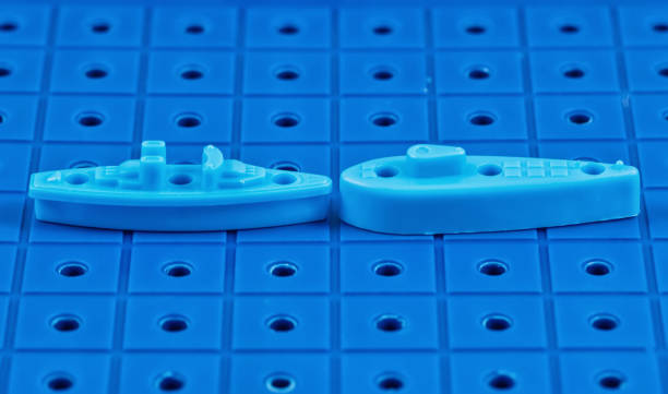 istock Toy war ships and a submarine lined up to play 664931860
