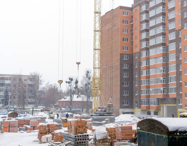 istock A construction site in winter snowstorm and cold weather. 664935308