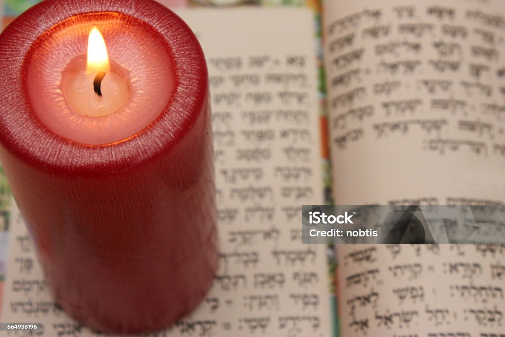 Judaism - Lit Candle - Psalm Judaism - Lit Candle - Psalm - Hebrew Candle Stock Photo