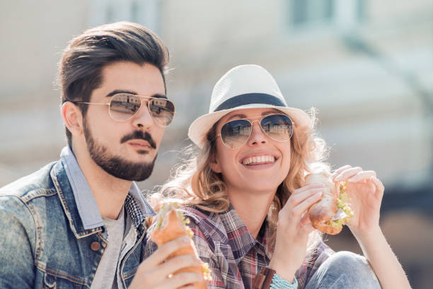 istock Couple eating sandwich 664938552