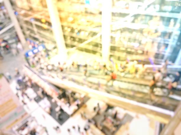 istock Blurred people on escalators are going to  shopping 664940006