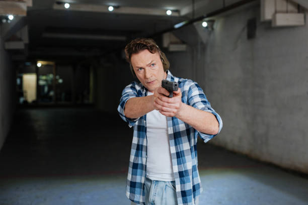 istock Pleasant serious man preparing to shoot 664940456