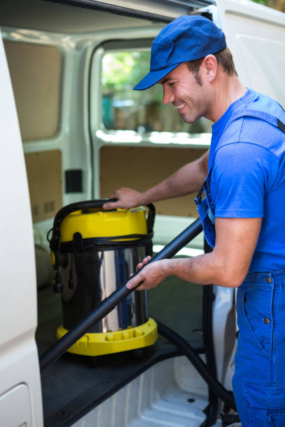 istock Happy janitor cleaning the car 664946876