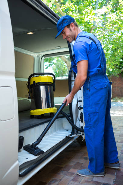 istock Happy janitor cleaning the car 664947264