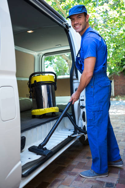 istock Happy janitor cleaning the car 664947438