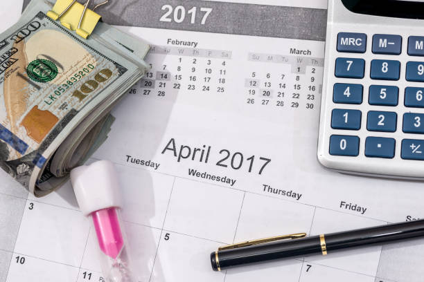 istock Hundred dollar bills with calendar, calculator. close up. 664947688