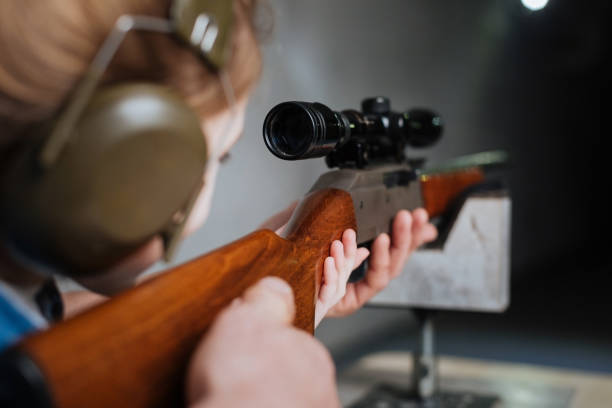 istock Confident pretty girl shooting at the target 664950178