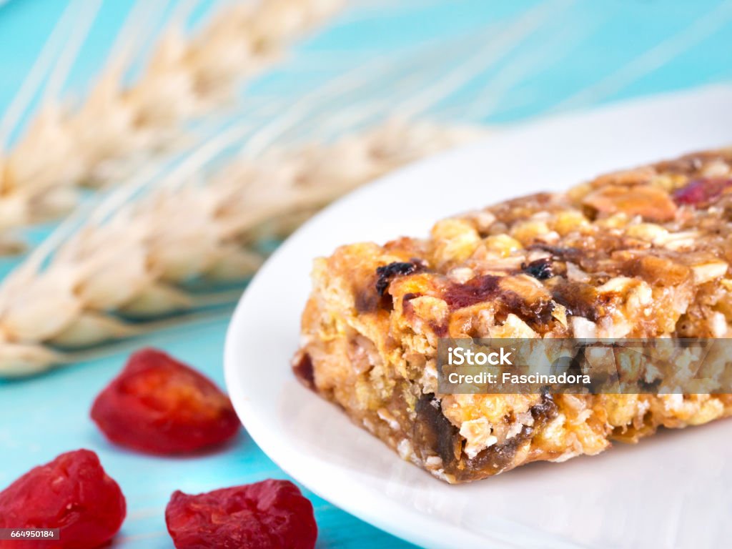 muesli bar on blue background muesli bar on cerulean blue background. Selective focus. Copy space Gymnastics Bar Stock Photo