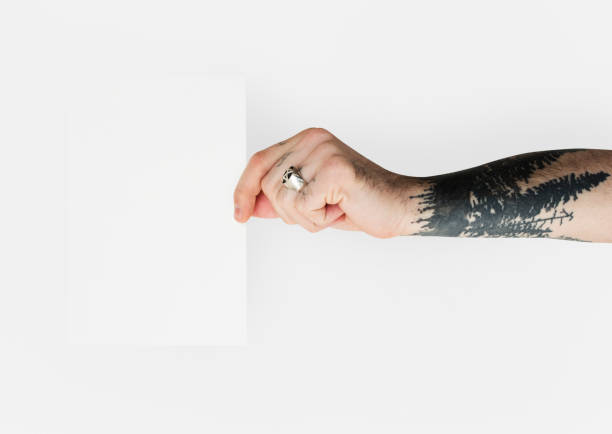 istock Tattoo Hand Holding Placard Isolated with Background 664950960