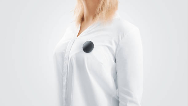 istock Blank black button badge mockup pinned on the womans chest 664954002