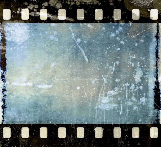 istock Vintage scratched film strip frame in blue tones. 664957532