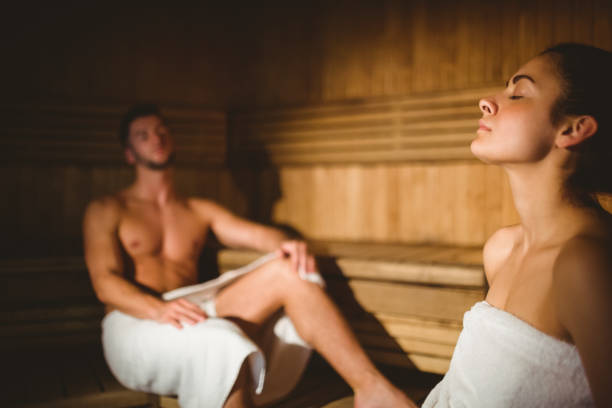 istock Happy couple enjoying the sauna together 664959654