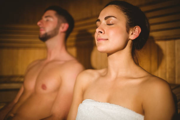 istock Happy couple enjoying the sauna together 664962064