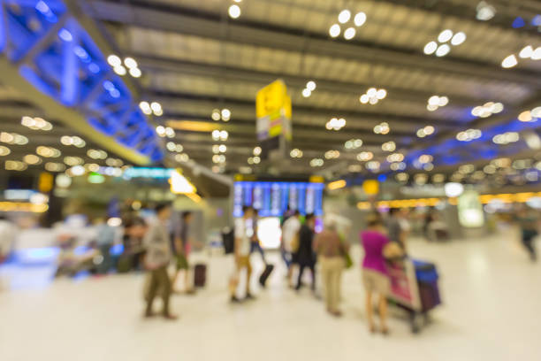 istock Blurred background : Traveler at airport terminal blur background with bokeh light 664962340