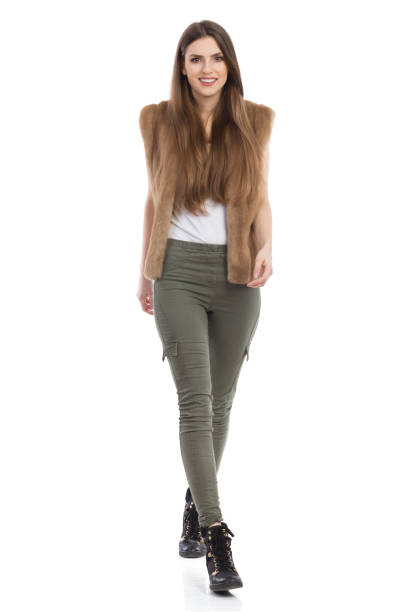 istock Smiling Woman Walking Towards Camera Isolated 664962364