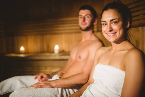 istock Happy couple enjoying the sauna together 664962656