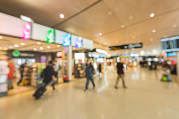 istock Blurred background : Traveler at airport terminal blur background with bokeh light 664962766
