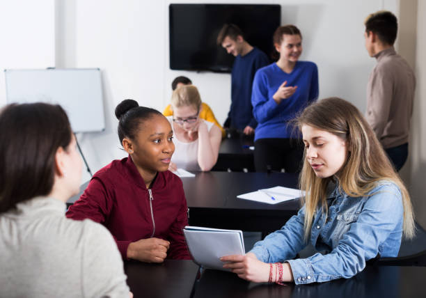 istock Girl consulting fellow student 664963086