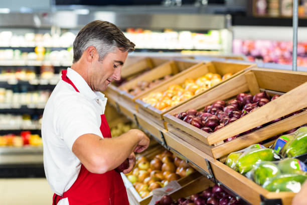 istock Seller filling vegetables box 664963648