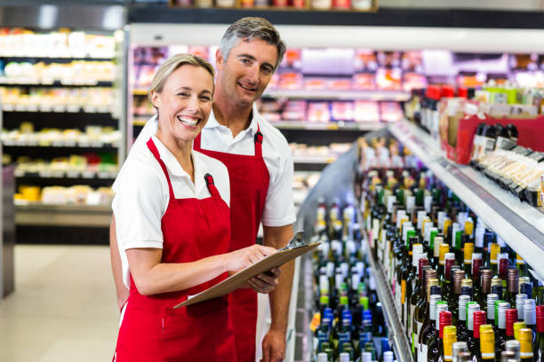 istock Smiling colleagues with clipboard 664968966