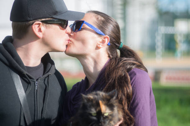 istock Outdoors, holding the cat in arms 664969084