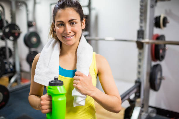 istock Smiling woman taking a break from workouts 664975748