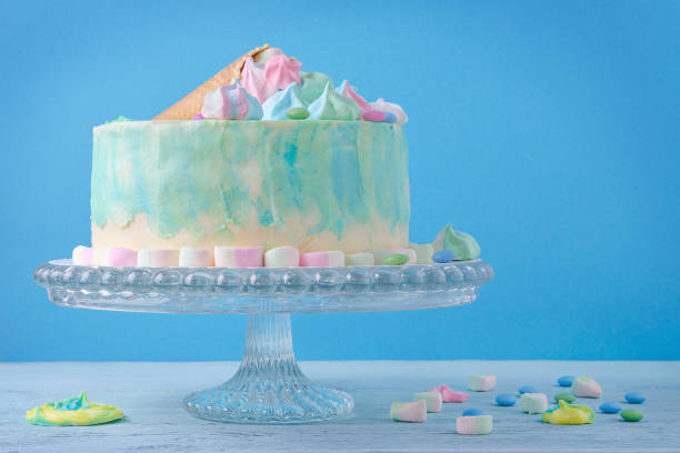 istock birthday cake in pastel colors on blue background 664979356