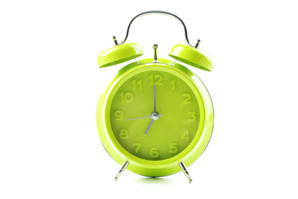 istock Green alarm clock isolated on a white 664979904